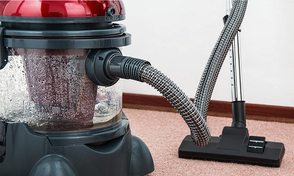 cleaning a carpet by vacuumin